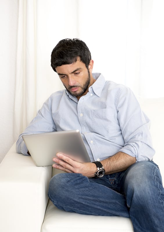 Man reading on a tablet